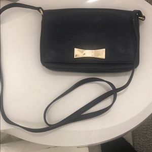 Kate Spade small blue crossbody bag.